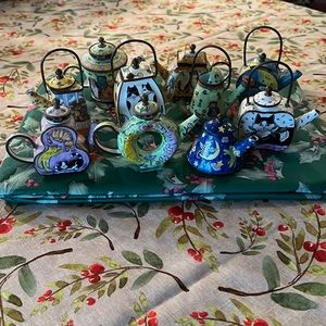 Bundle of 10 miniature metal cat teapots.